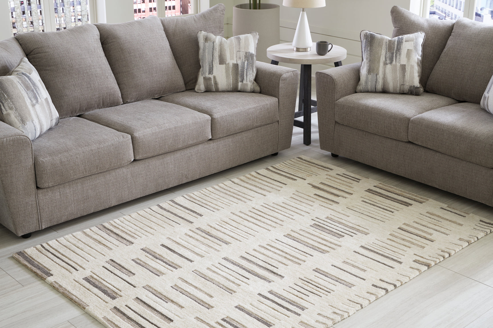 Sam's Furniture - Ashley Furniture - Leesdale Rug - 5' x 7' Rug / Ivory/Brown/Black - R406422