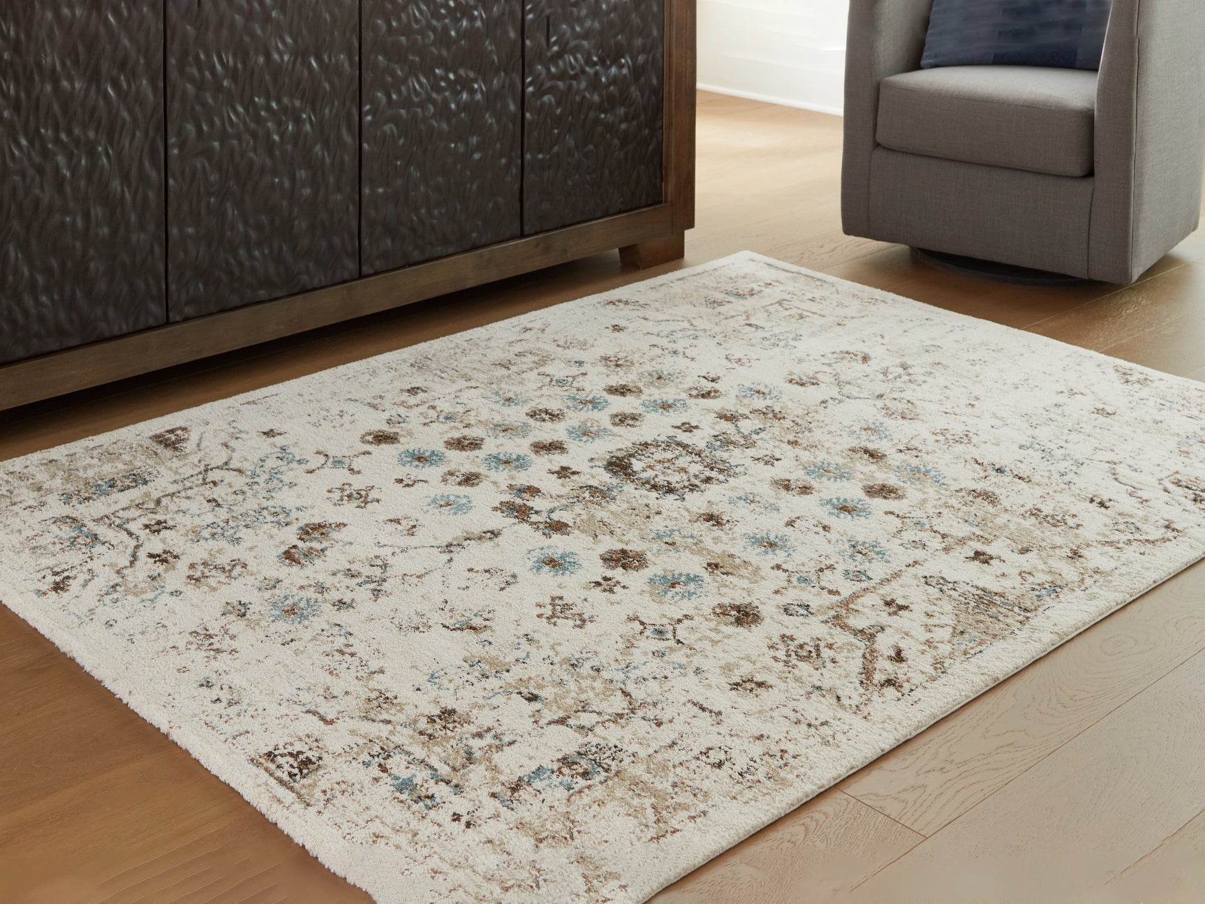 Sam's Furniture - Ashley Furniture - Jossler Rug - 5' x 7' Rug / Ivory/Brown/Teal - R407072
