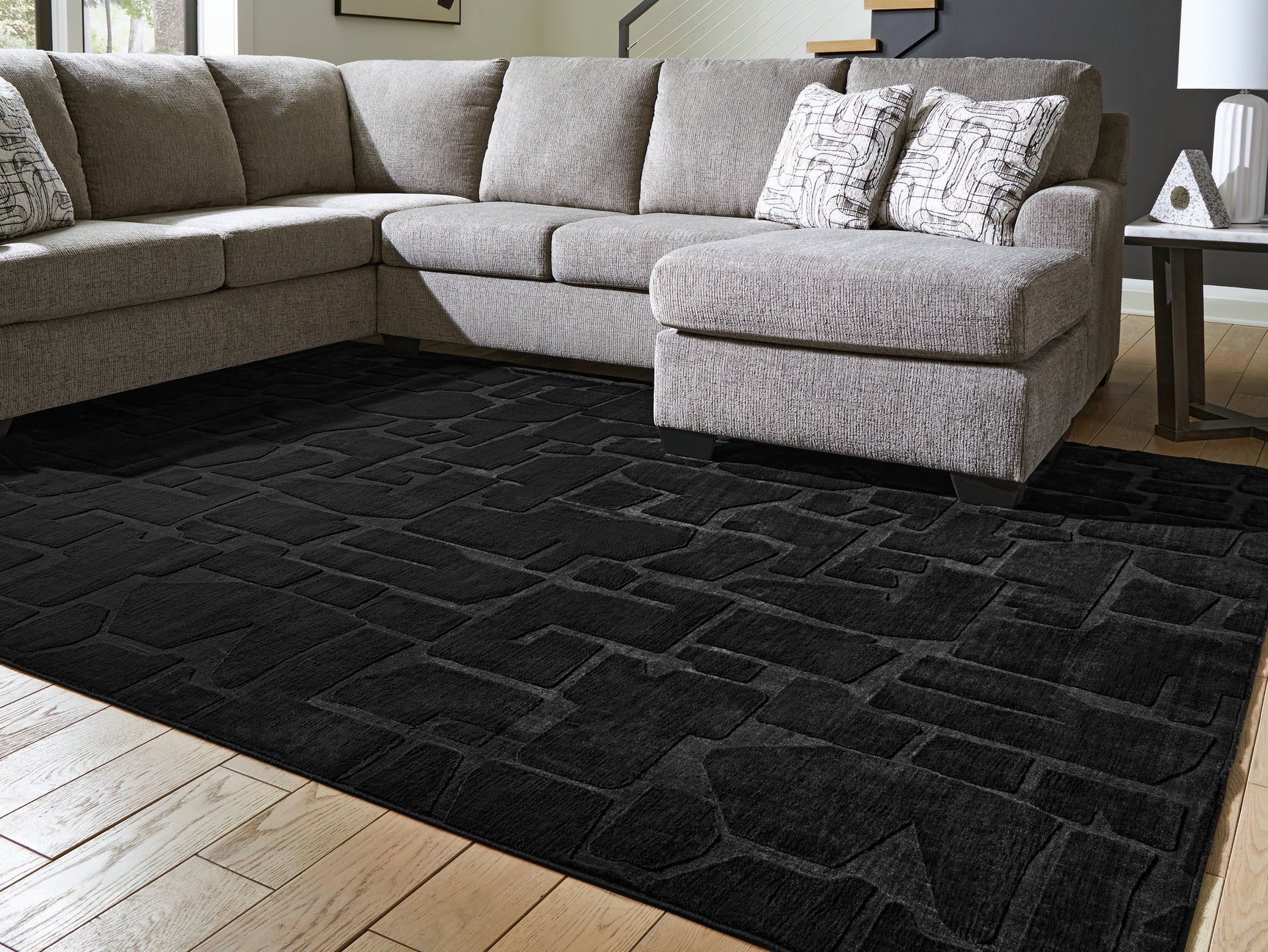 Sam's Furniture - Ashley Furniture - Gibbswell Rug - Washable 8' x 10' Area Rug / Black - R407461
