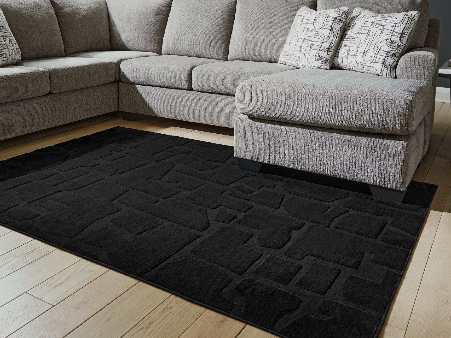 Sam's Furniture - Ashley Furniture - Gibbswell Rug - Washable 5' x 7' Area Rug / Black - R407462