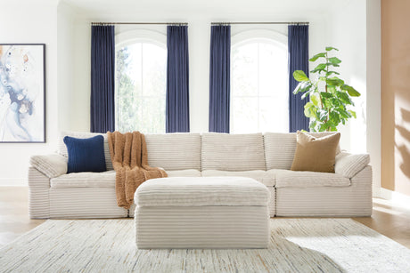 Sam's Furniture - Ashley Furniture - Fannin Sectional - RAF 4-Piece Sectional with Ottoman / Ivory - PC84304S1