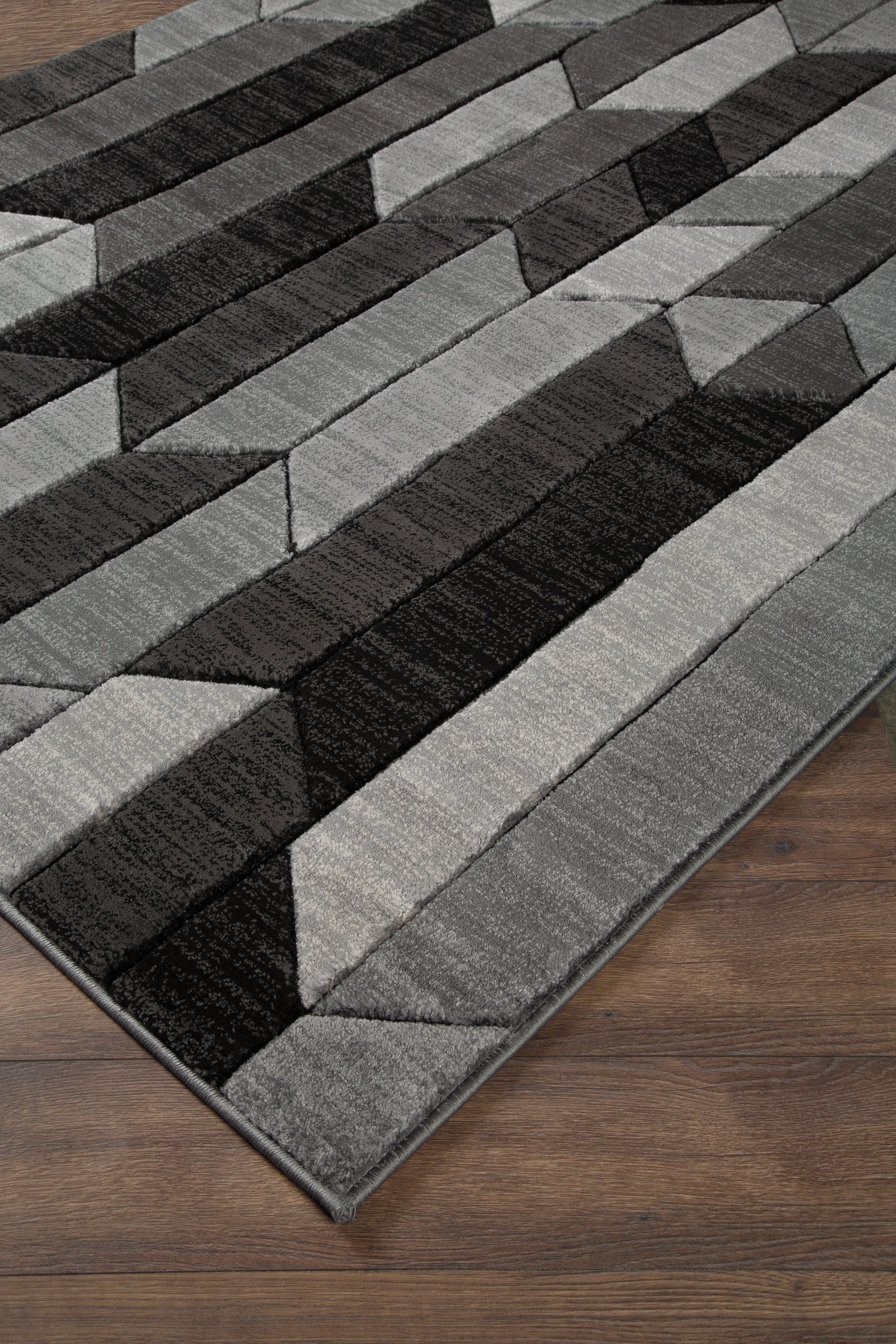 Sam's Furniture - Ashley Furniture - Chayse Rug - 6'6" x 9'6" Rug / Black/Gray - R403461