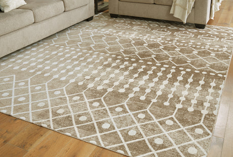 Sam's Furniture - Ashley Furniture - Bunchly Rug - 7'10" x 10'3" Washable Rug / Tan/Brown/Cream - R406221