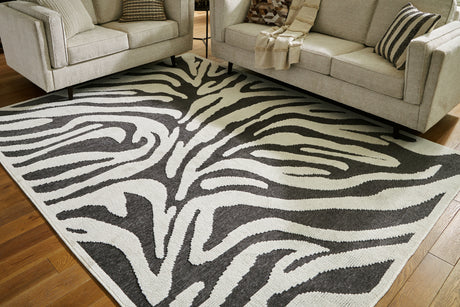 Sam's Furniture - Ashley Furniture - Thomwith Rug - 8' x 10'2" Washable Rug / Black/Ivory - R406291