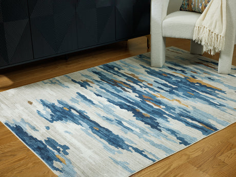 Sam's Furniture - Ashley Furniture - Vinlett Rug - 5' x 7' Washable Rug / Cream/Blue/Brown - R407042