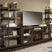Sam's Furniture - Ashley Furniture - Starmore 3-Piece Wall Unit with Electric Fireplace - 3-Piece Wall Unit with Electric Fireplace / Brown/Gunmetal - W633W6